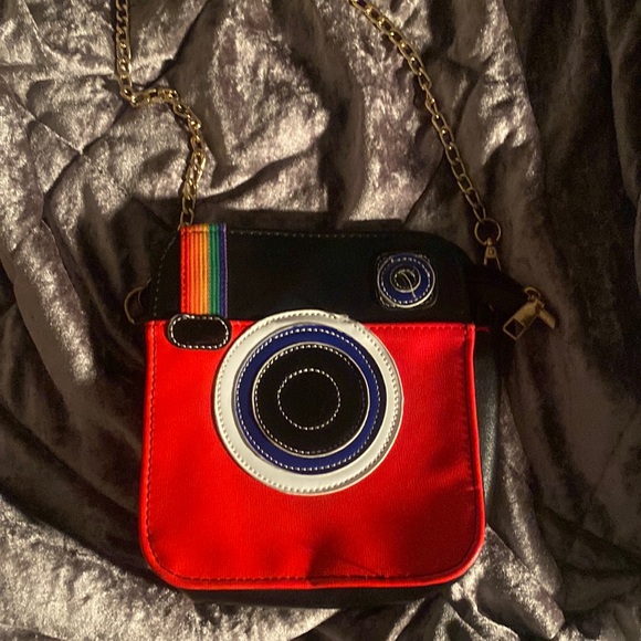 Handbags - This is another purse that I was given❤️. Its like a camera kind of.